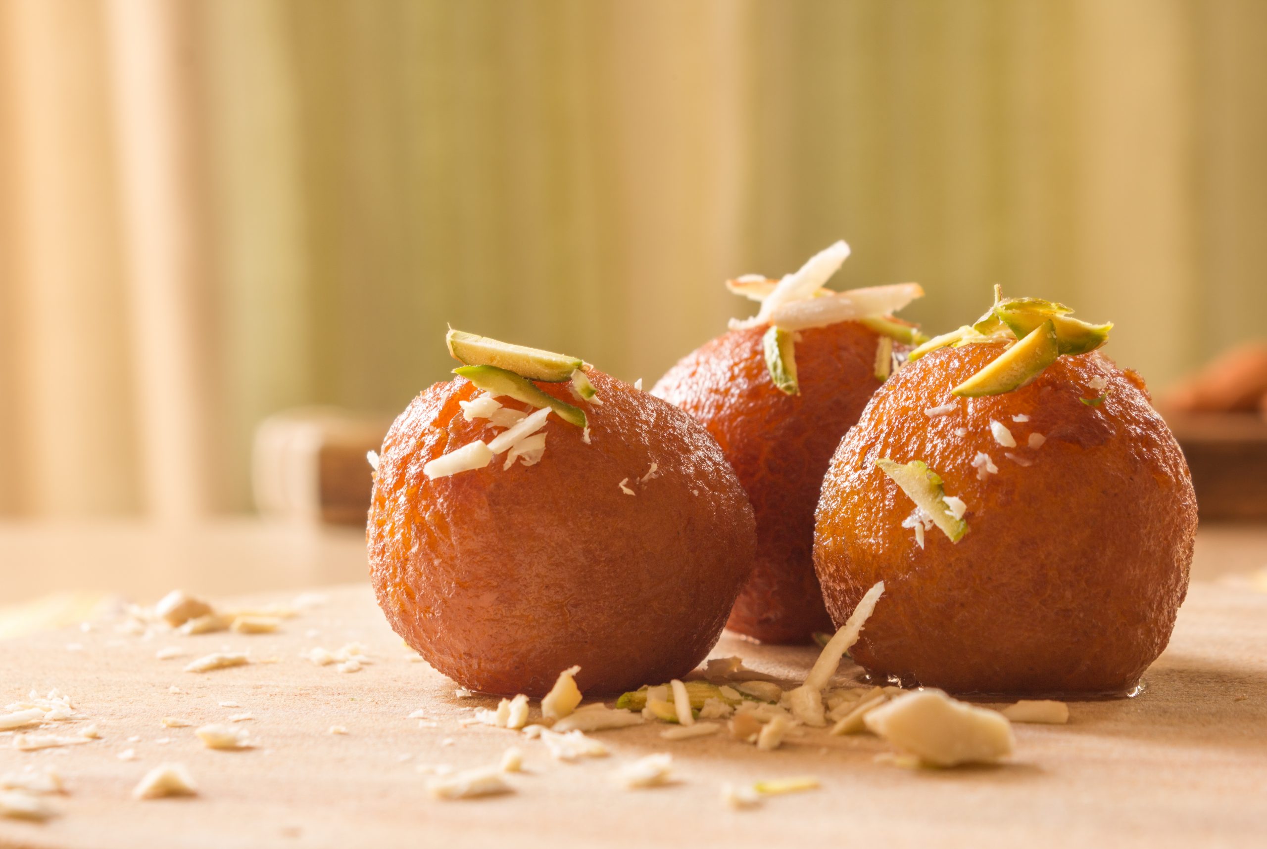 Gulab,Jamuns,,Indian,Dessert,Topped,With,Cashews,,Pistachio,And,Almonds. Gulab Jamun - Indian Desserts